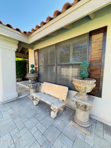 a view of a swimming pool with outdoor seating
