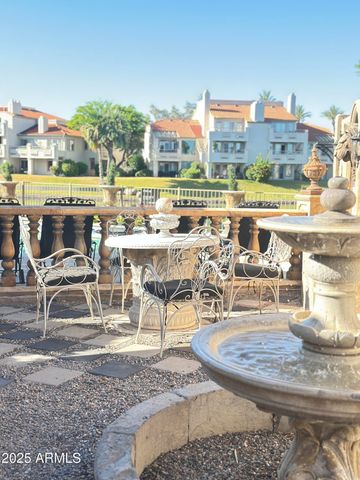 a view of a house with backyard porch and sitting area