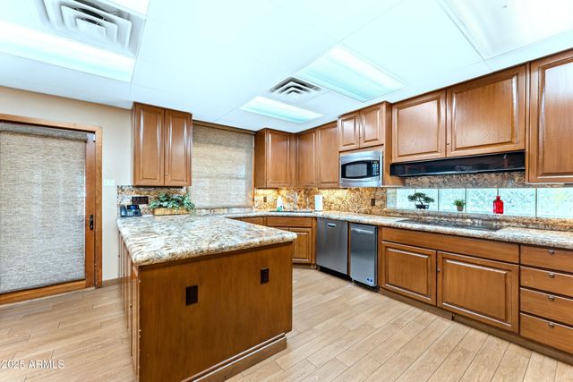 a bench with a table and chairs