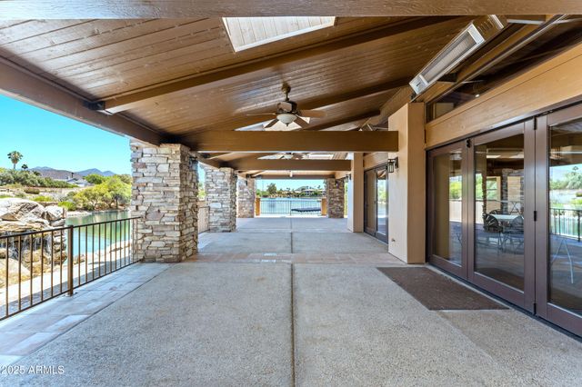an aerial view of residential houses with outdoor space and river