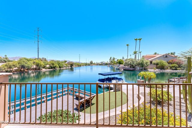 a view of a town with swimming pool and mountains