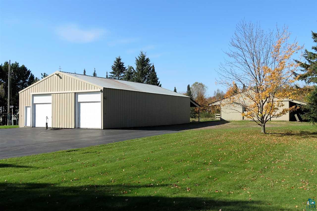 227 Jay Cooke Road Esko, MN 55733 - Photo 3 of 19 36x64 with 25x36 insulated and heated car parking. The rest storage. 36x13 lean too