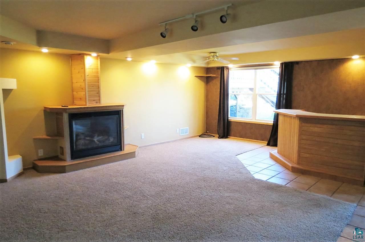 227 Jay Cooke Road Esko, MN 55733 - Photo 8 of 19 Lower level with wet bar and fireplace