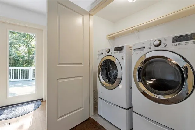 a view of a hallway with washer and dryer