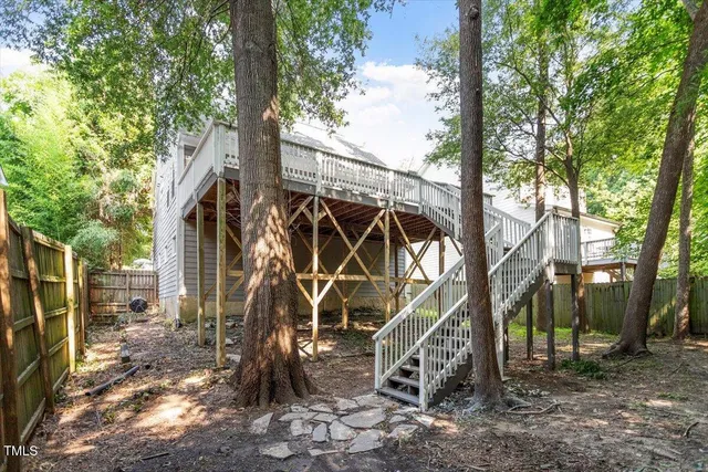 a tree in the backyard of a house