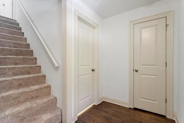 a view of an entryway with wooden floor