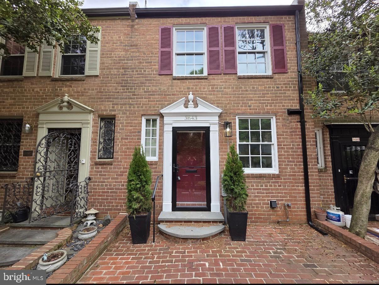 a front view of a house with a porch