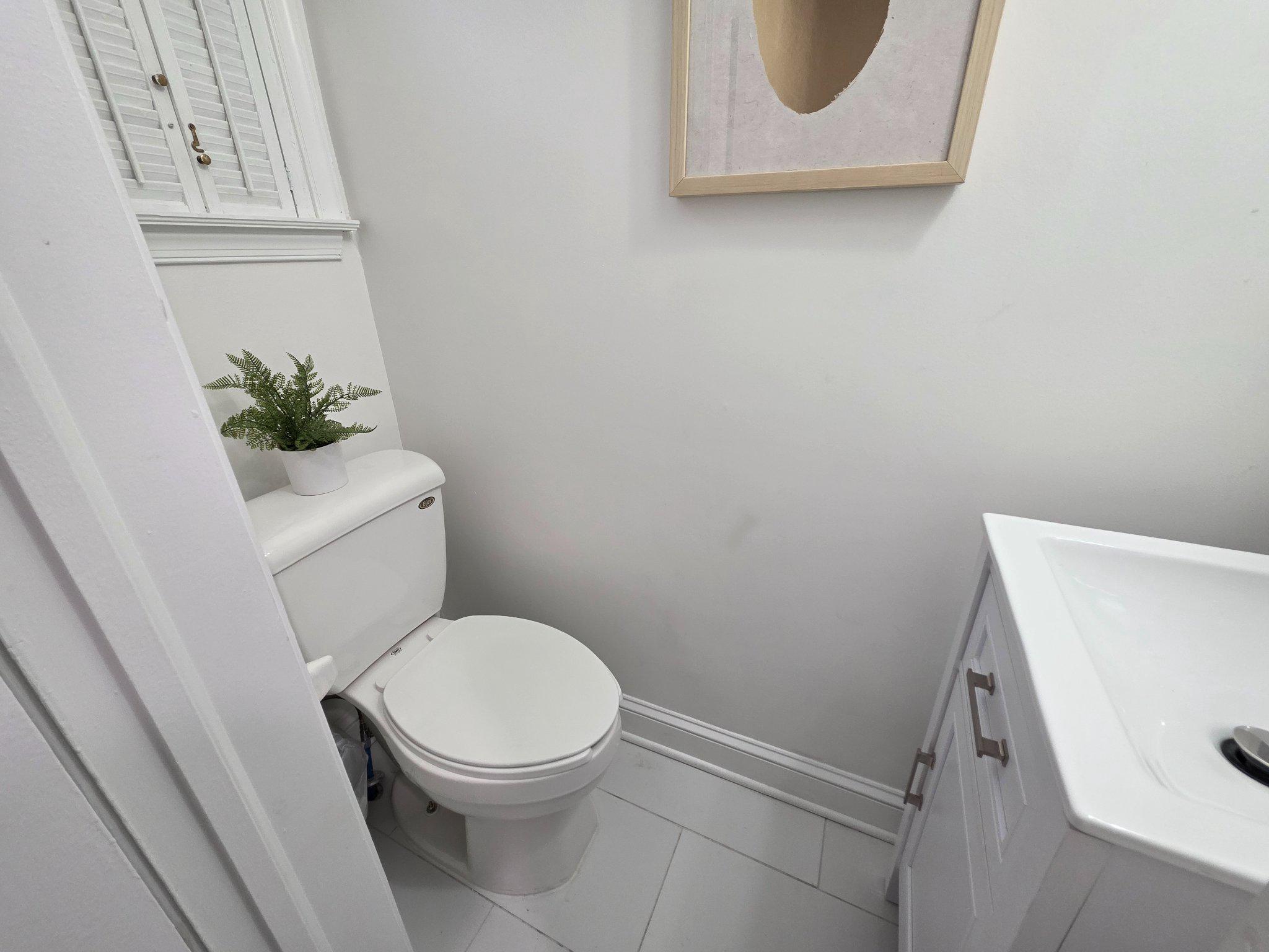 3643 St Mary's Place Northwest Washington, DC 20007 - Photo 19 of 49 a white toilet sitting next to a white sink