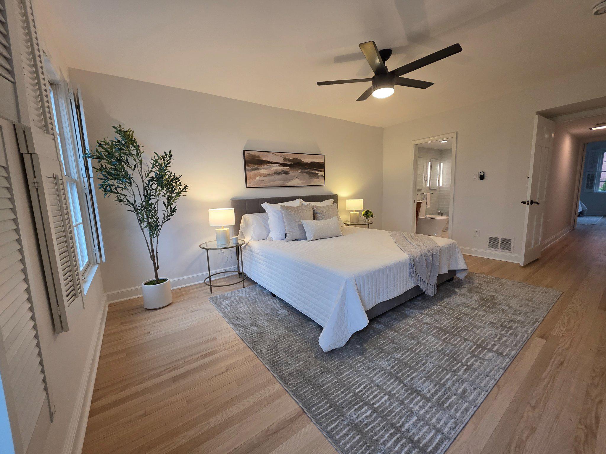 3643 St Mary's Place Northwest Washington, DC 20007 - Photo 20 of 49 a spacious bedroom with a bed and a chandelier