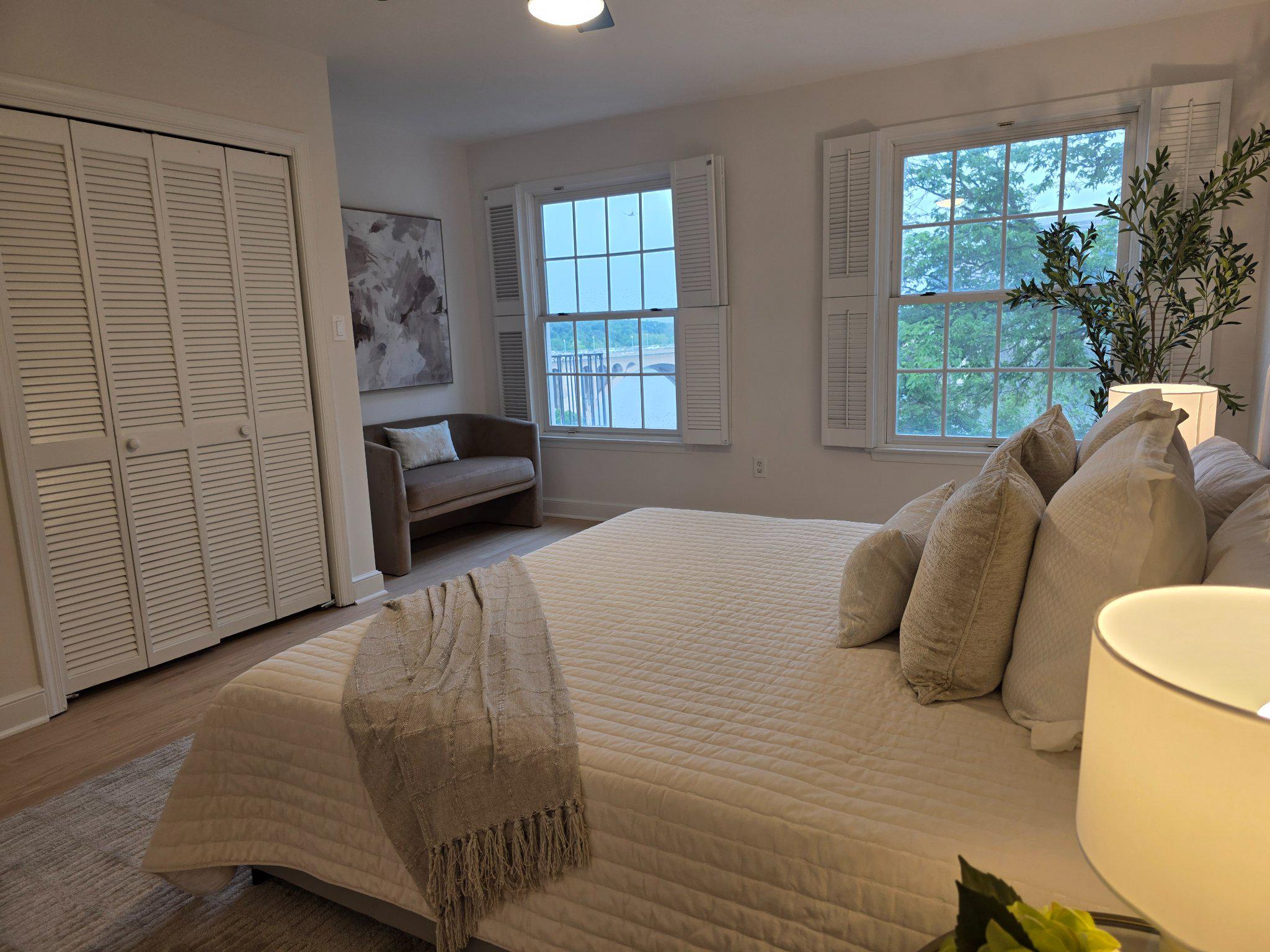 3643 St Mary's Place Northwest Washington, DC 20007 - Photo 22 of 49 a bedroom with a bed and a large window
