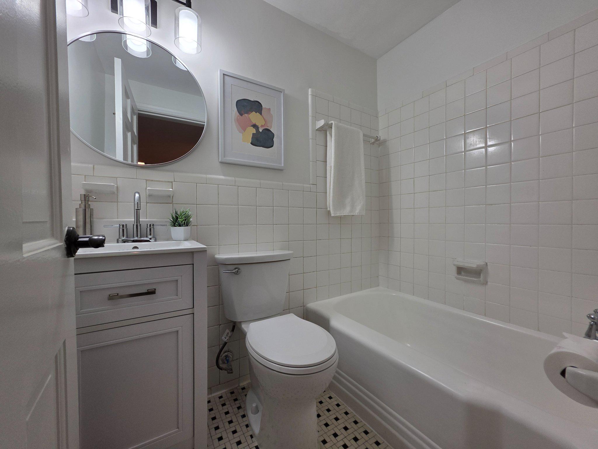 3643 St Mary's Place Northwest Washington, DC 20007 - Photo 36 of 49 a bathroom with a toilet sink and mirror