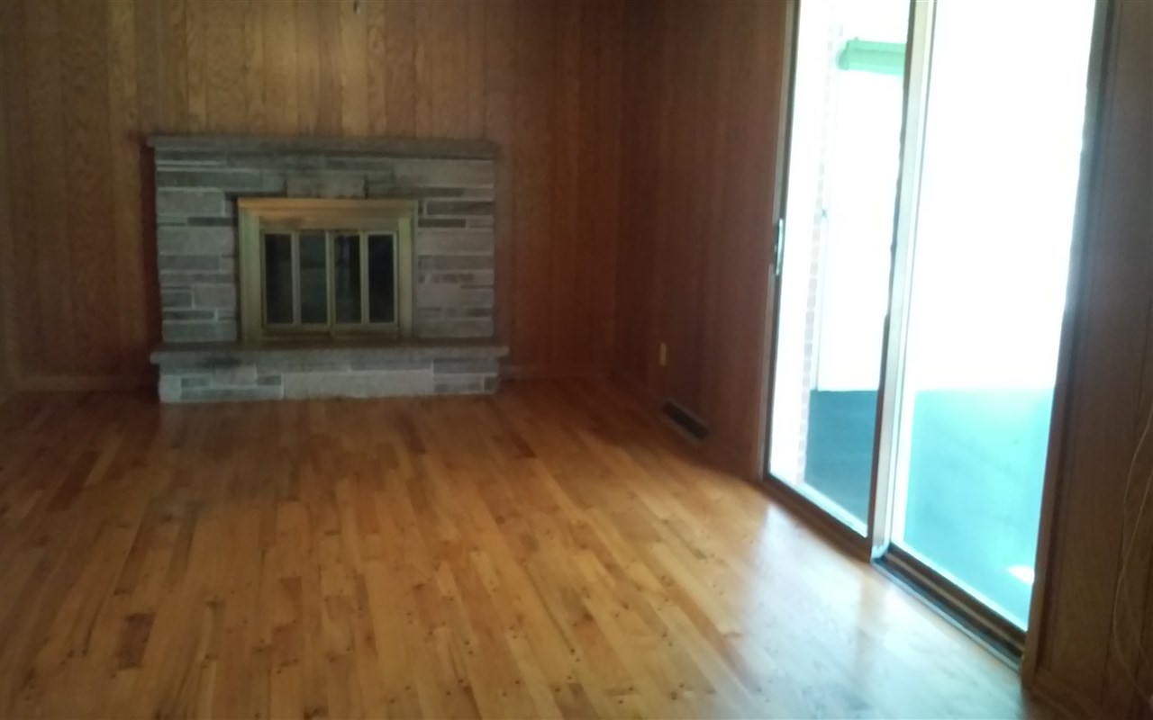 5035 Welsh Road Rockford, IL 61107 - Photo 11 of 15 a view of a hallway with wooden floor