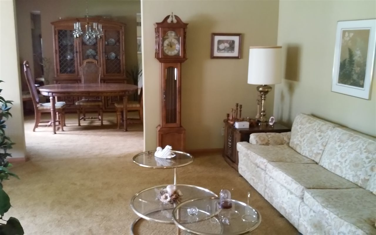 5035 Welsh Road Rockford, IL 61107 - Photo 6 of 15 a living room with furniture and wooden floor