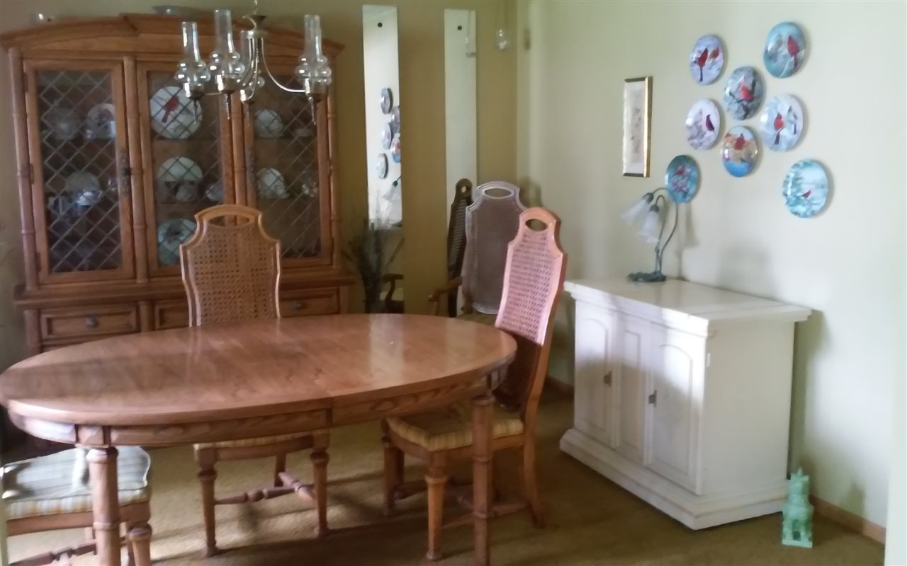 5035 Welsh Road Rockford, IL 61107 - Photo 7 of 15 a view of a dining room with furniture and chandelier
