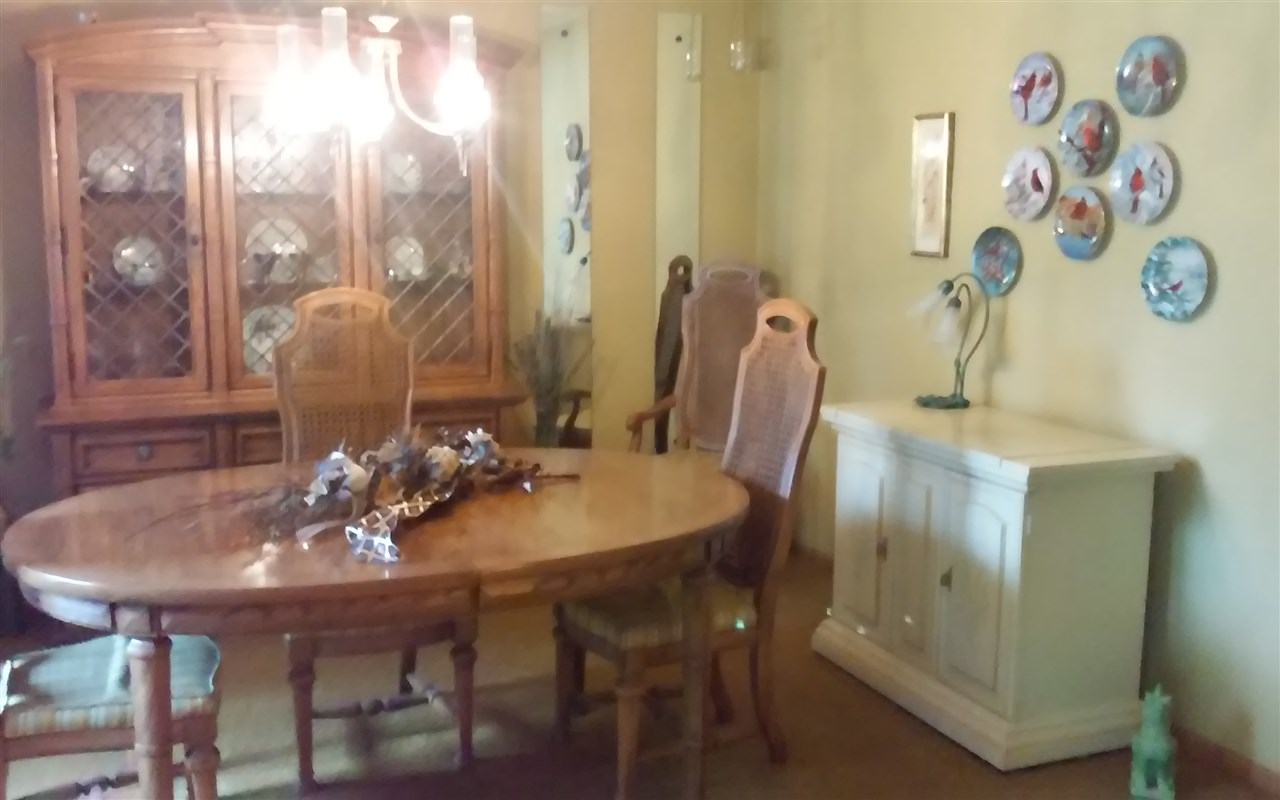 5035 Welsh Road Rockford, IL 61107 - Photo 8 of 15 a view of a dining room with furniture and wooden floor