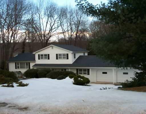 23 Buddington Road Shelton, CT 06484 - Photo 1 of 1 a front view of a house with a yard and garage