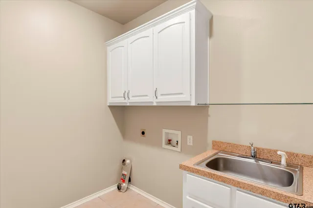 a close view of a sink and cabinets