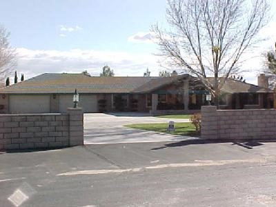 19519 Shasta Road Apple Valley, CA 92307 - Photo 1 of 1 a view of a house with a garden and yard
