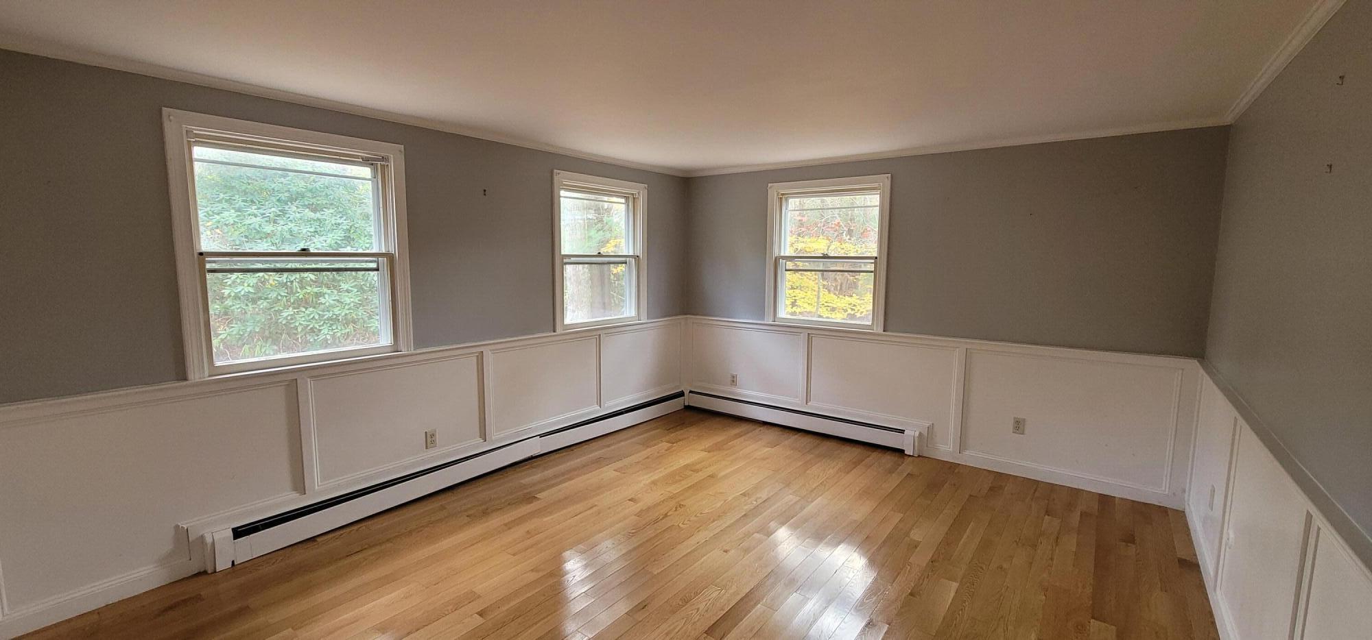 79 Emerson Way Centerville, MA 02632 - Photo 6 of 13 a view of an empty room with wooden floor and a window