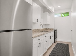 2107 Kaiwiki Road Hilo, HI 96720 - Photo 11 of 30 a bathroom with a granite countertop sink and a granite counter top