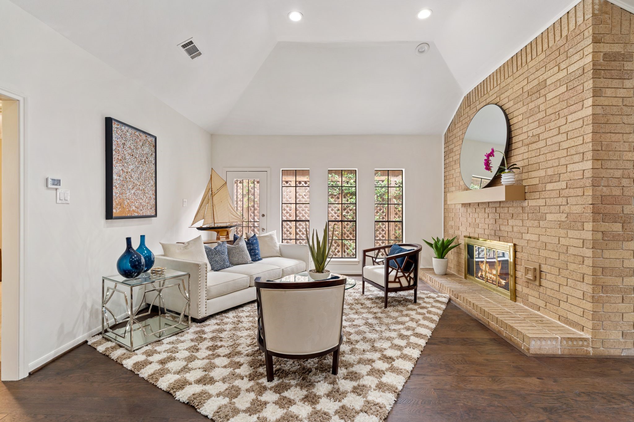7416 Kelving Street Houston, TX 77030 - Photo 4 of 35 a living room with fireplace furniture and a potted plant