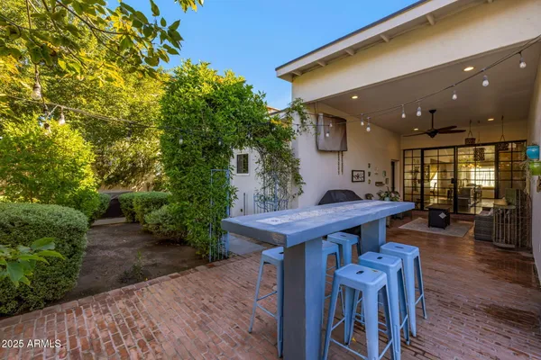 a view of a chairs and table in the patio