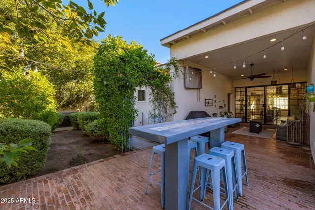 a view of a chairs and table in the patio