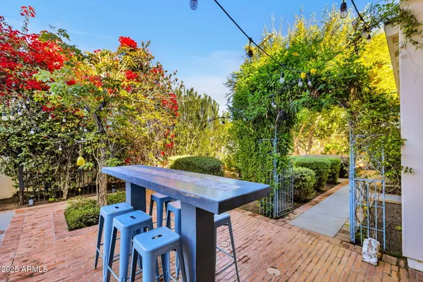 a view of a chairs and table in the patio