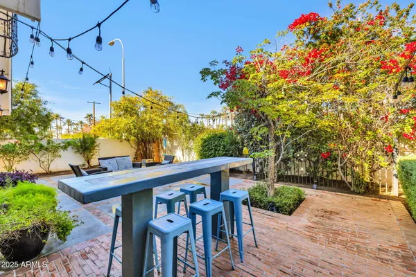 a view of a chairs and table in the patio