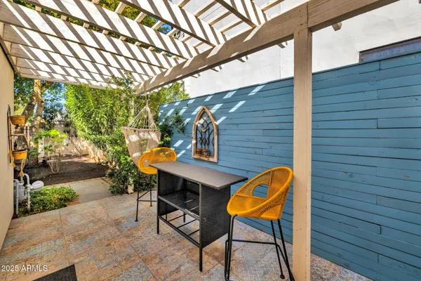 a backyard of a house with seating space