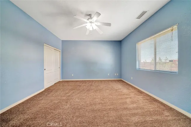 a bathroom with a granite countertop sink mirror toilet and bathtub