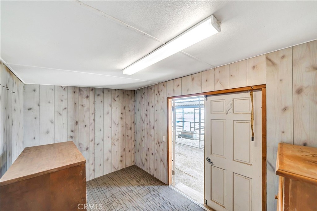 7315 West Ave A 8 Lancaster, CA 93536 - Photo 56 of 65 a view of an empty room with wooden floor and a window