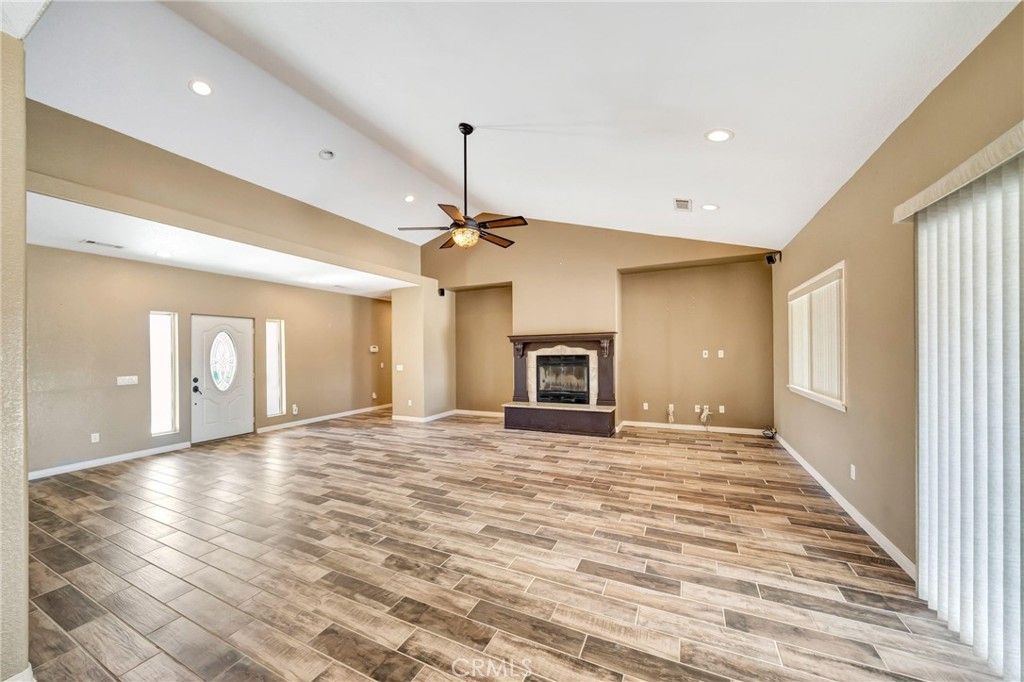 7315 West Ave A 8 Lancaster, CA 93536 - Photo 8 of 65 a view of an empty room with window and fireplace