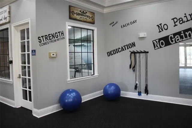 a view of a house with a swimming pool and a chair
