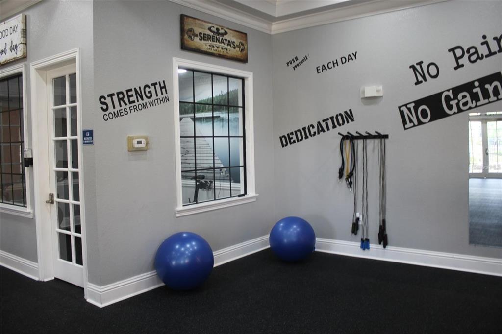 6159 Metrowest Boulevard, Unit 101 Orlando, FL 32835 - Photo 5 of 6 a front view of a house with entryway and stairs