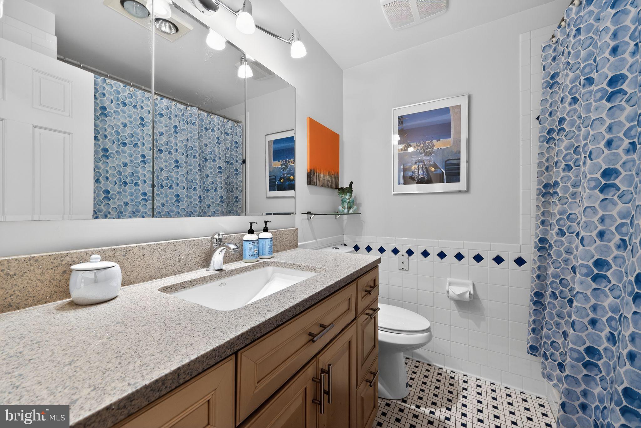 123 Pearl Croft Road Cherry Hill, NJ 08034 - Photo 19 of 41 Hallway bathroom with vibrant tile accents.