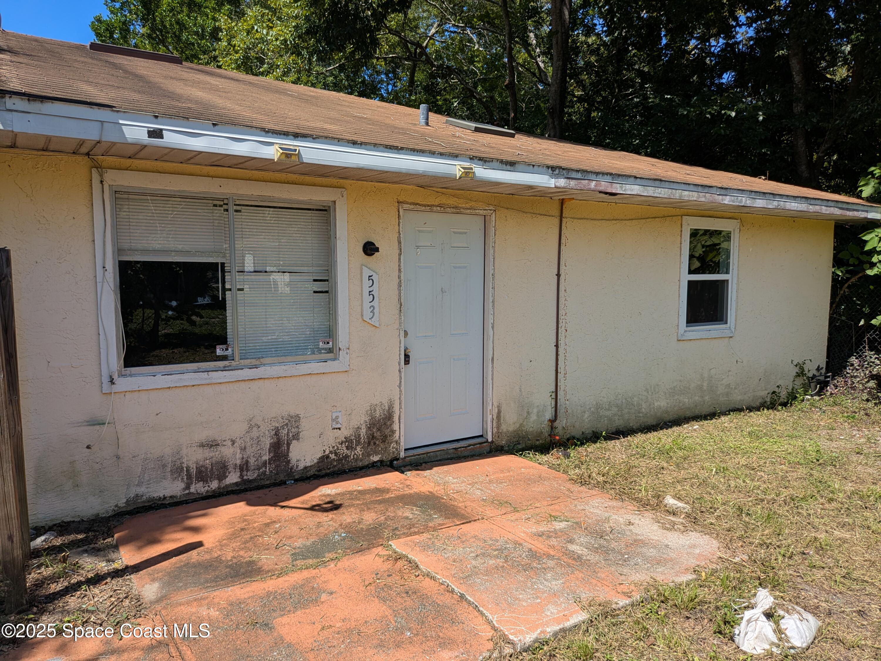 553 Rock Pit Road Titusville, FL 32796 - Photo 1 of 14 a front view of a house