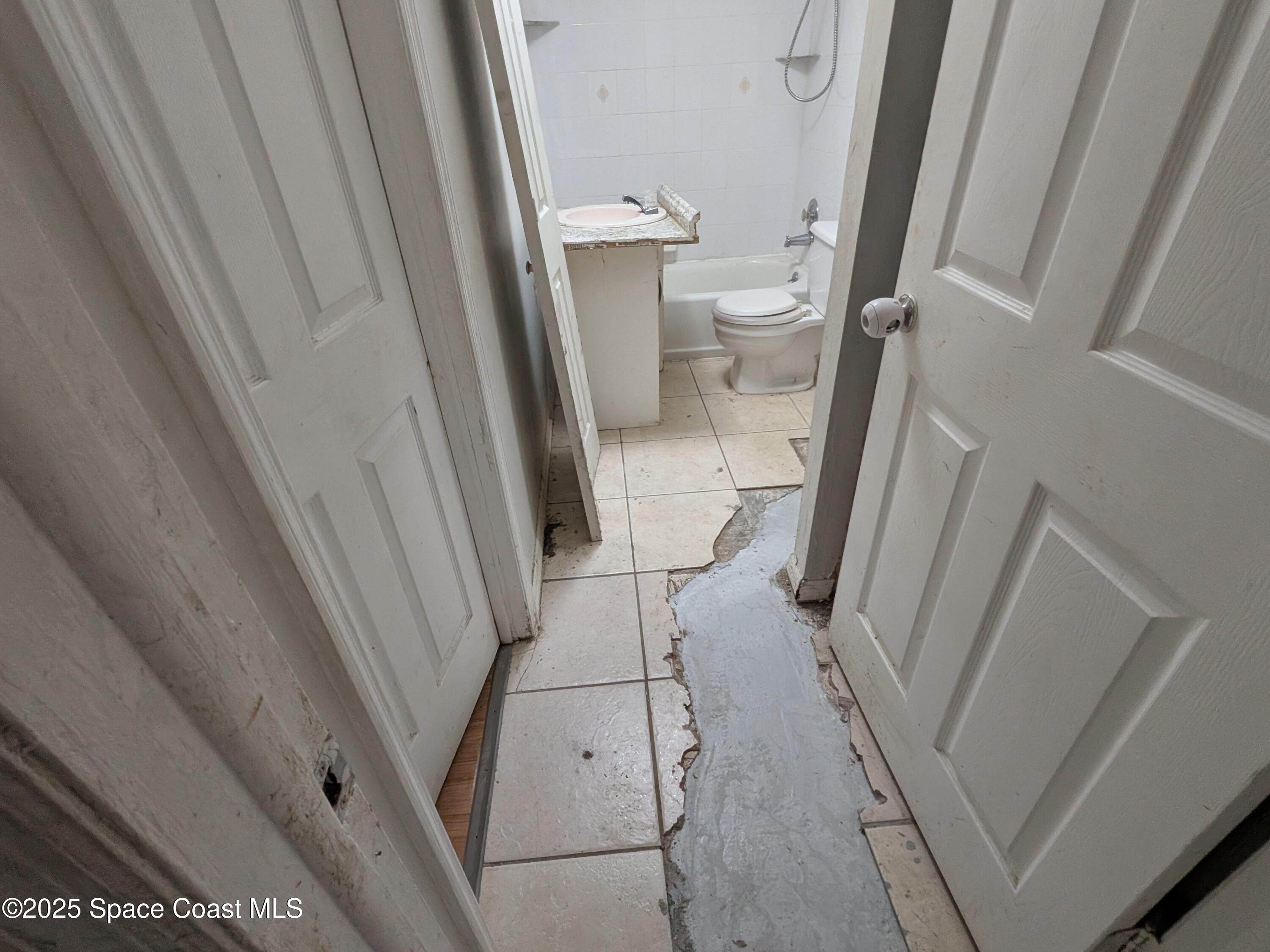 553 Rock Pit Road Titusville, FL 32796 - Photo 11 of 14 a bathroom with a sink and a toilet