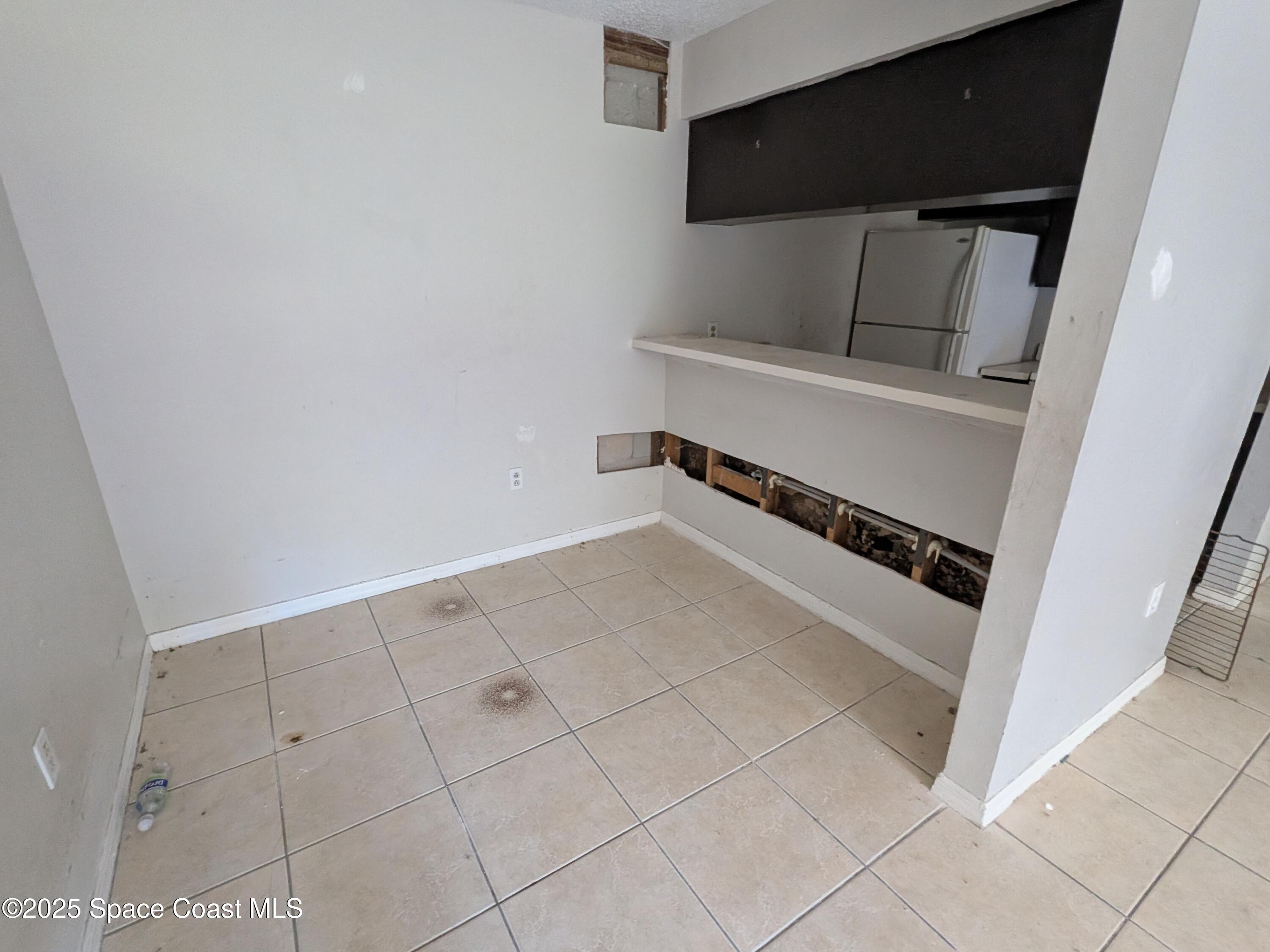 553 Rock Pit Road Titusville, FL 32796 - Photo 5 of 14 a view of storage and utility room with washer and dryer
