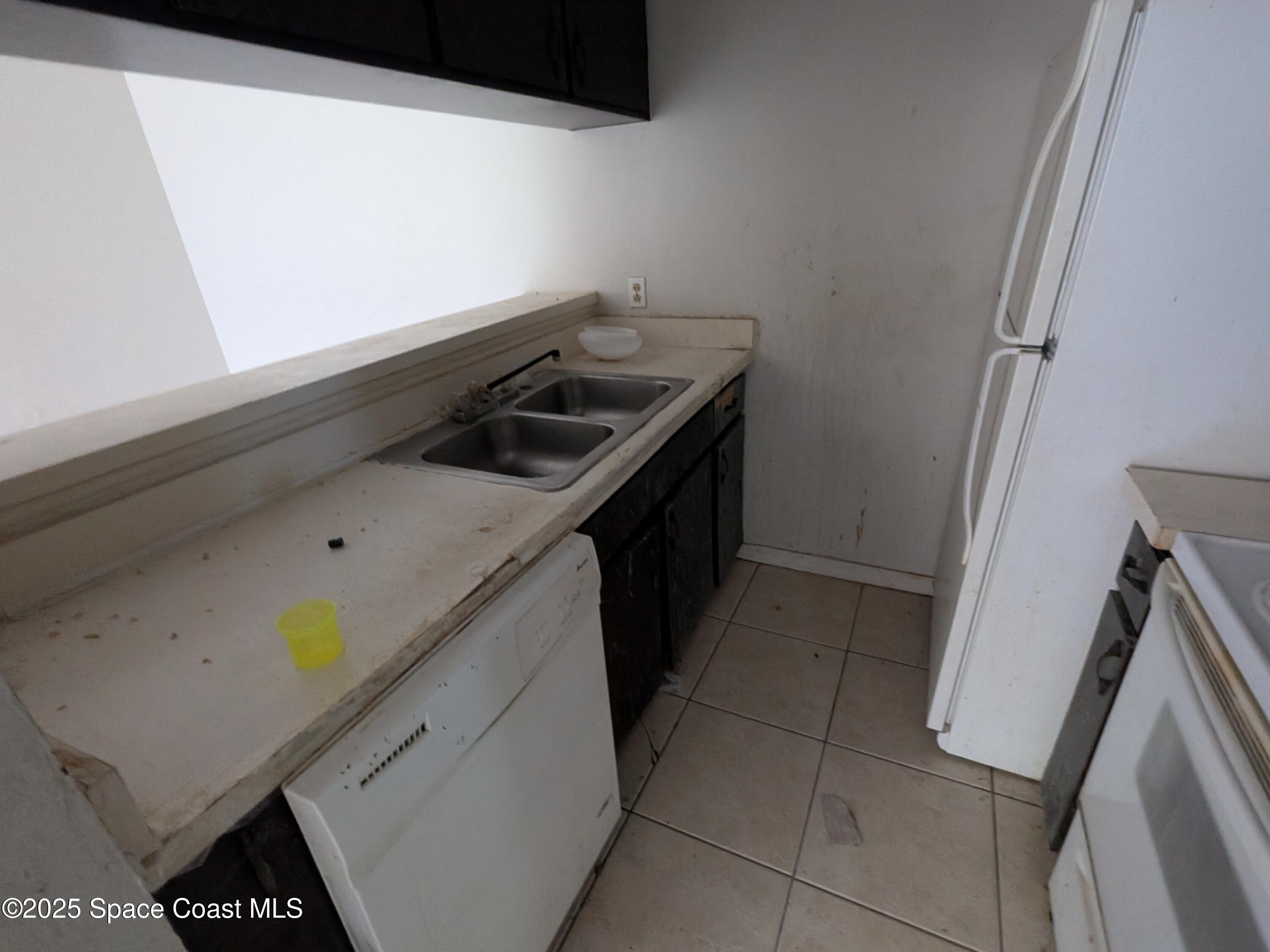 553 Rock Pit Road Titusville, FL 32796 - Photo 8 of 14 a utility room with dryer and washer