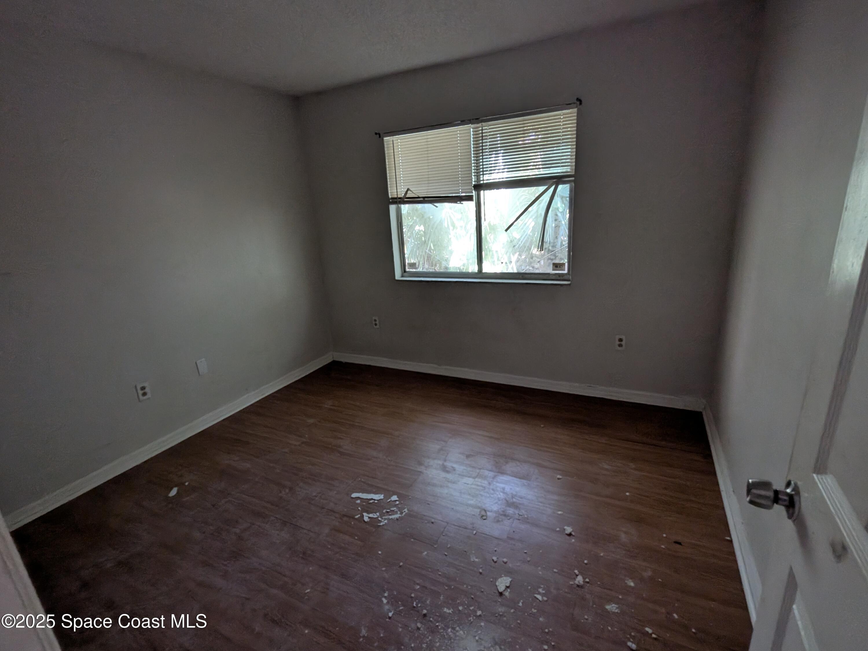 553 Rock Pit Road Titusville, FL 32796 - Photo 9 of 14 an empty room with a window