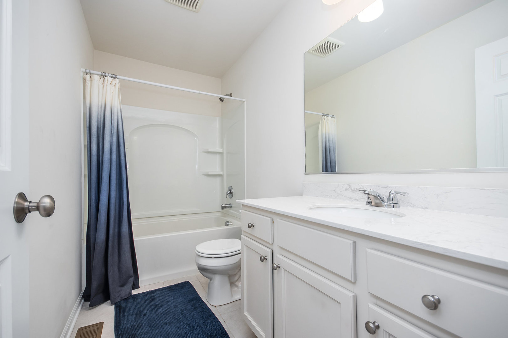 4166 Calder Lane Aurora, IL 60504 - Photo 18 of 30 a bathroom with a sink a toilet and shower