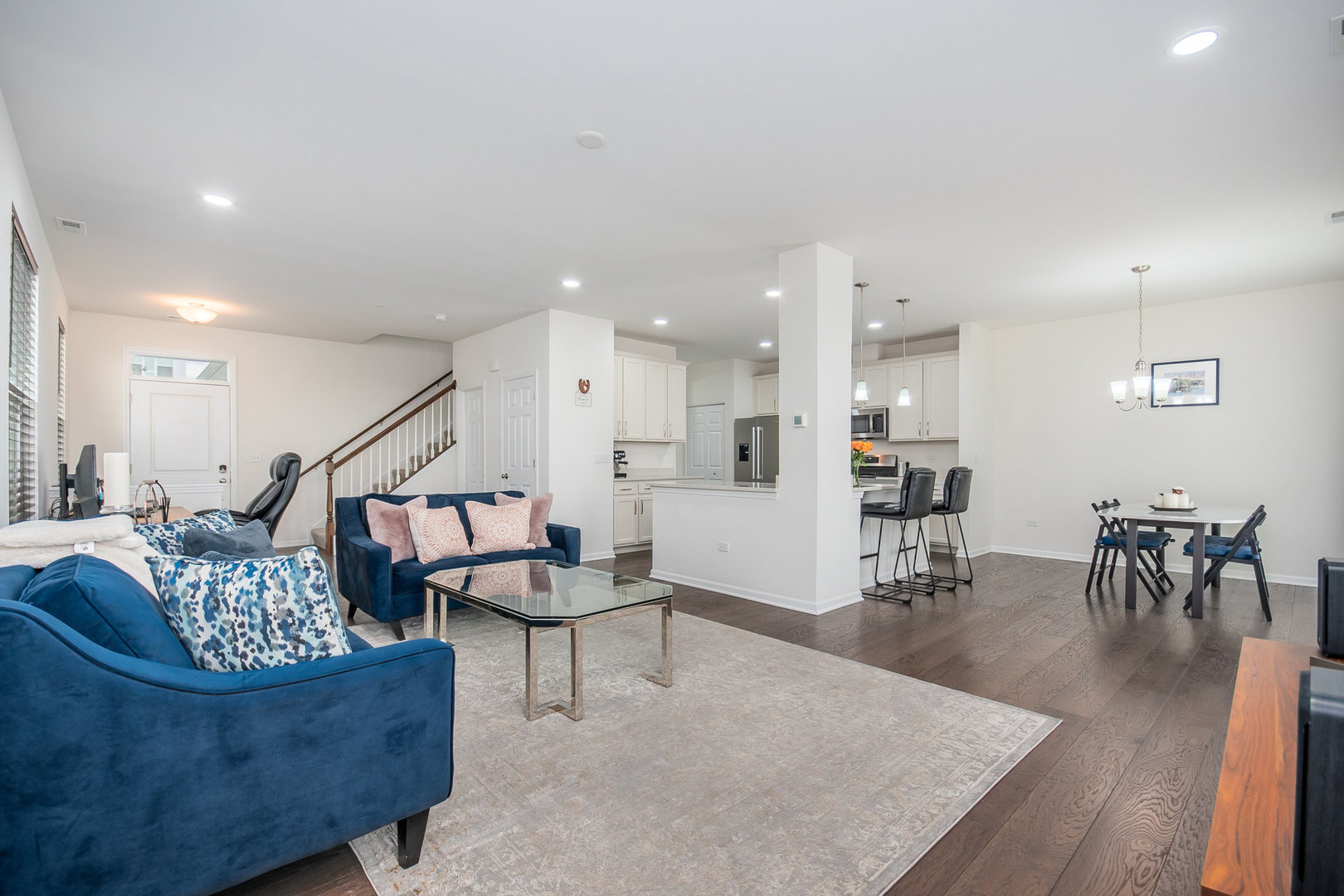 4166 Calder Lane Aurora, IL 60504 - Photo 2 of 30 a living room with furniture and a dining table with wooden floor
