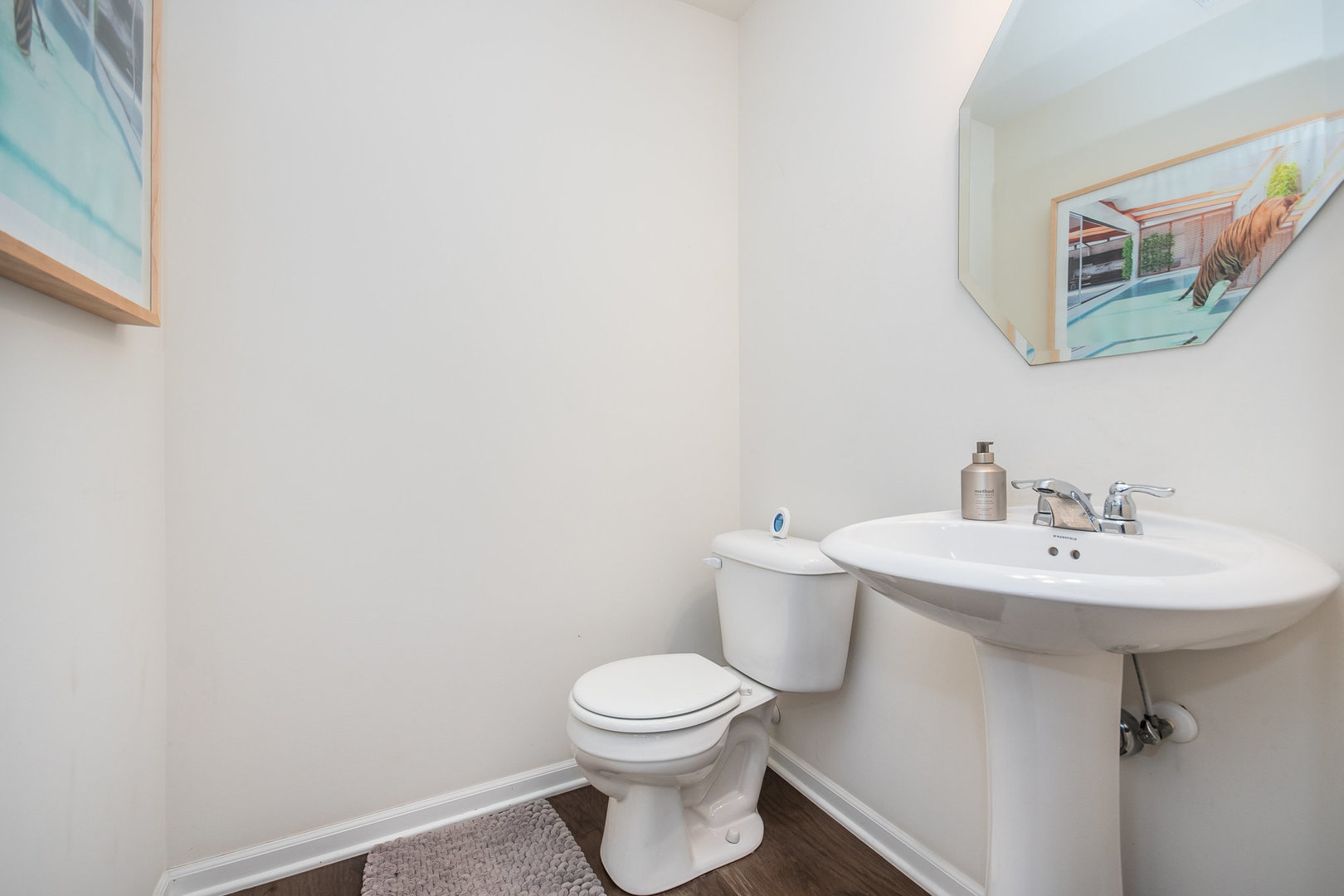 4166 Calder Lane Aurora, IL 60504 - Photo 9 of 30 a bathroom with a sink a toilet and mirror