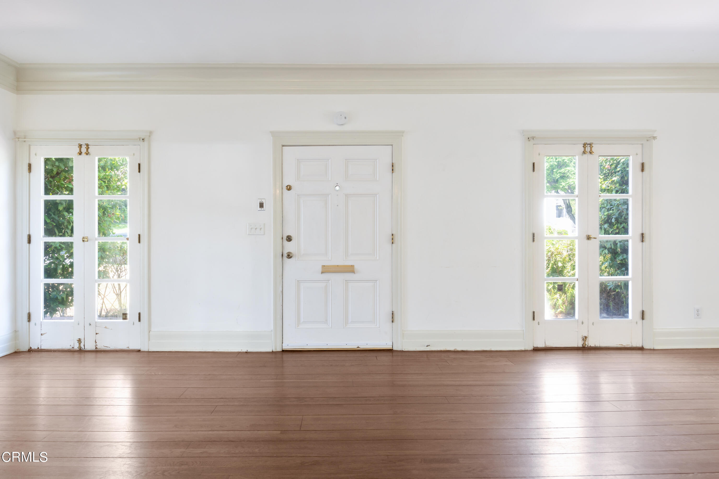 430 West Kenneth Road Glendale, CA 91202 - Photo 11 of 73 a view of an empty room with wooden floor and a window
