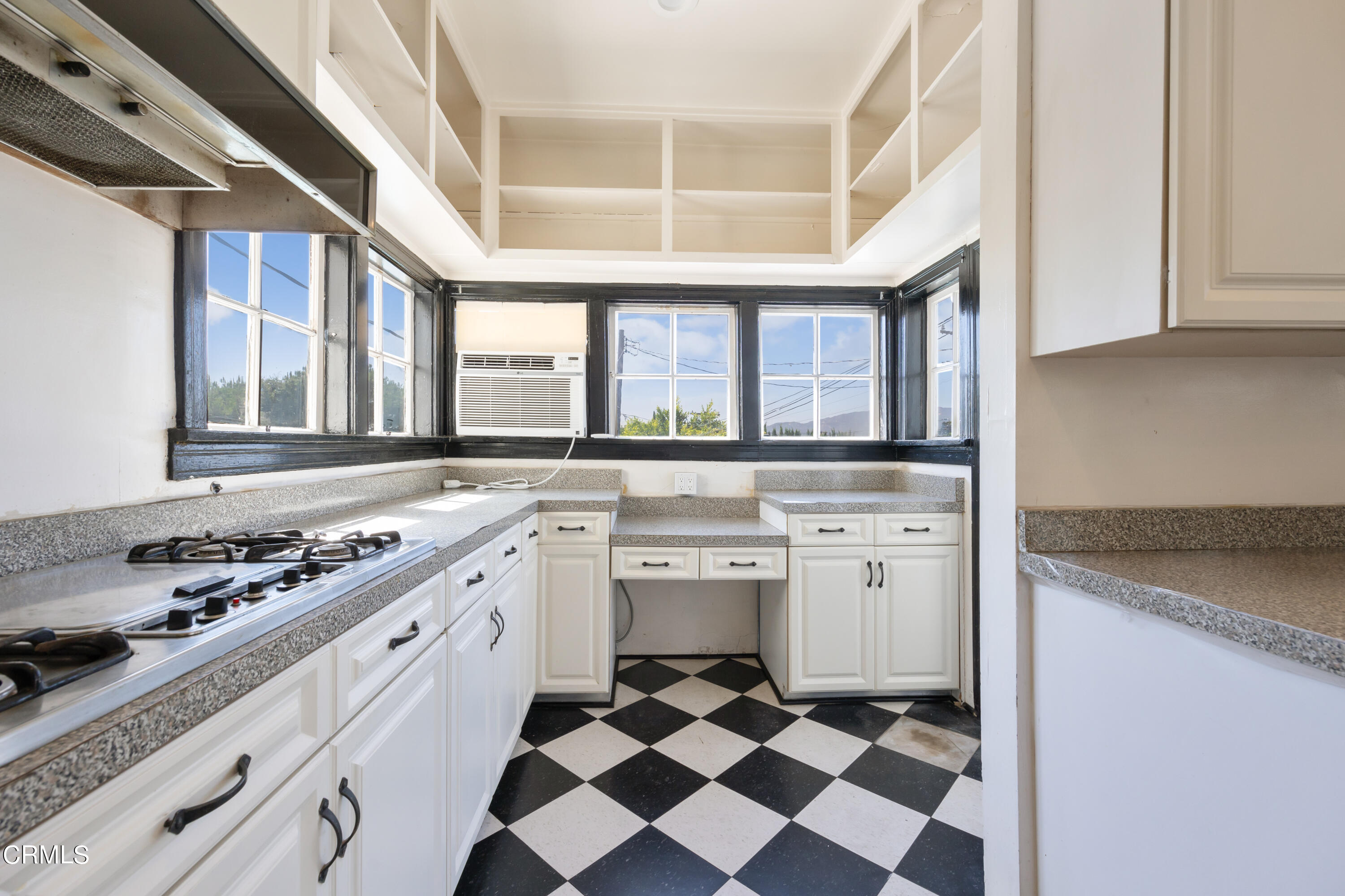 430 West Kenneth Road Glendale, CA 91202 - Photo 24 of 73 a kitchen with a stove a sink and a refrigerator