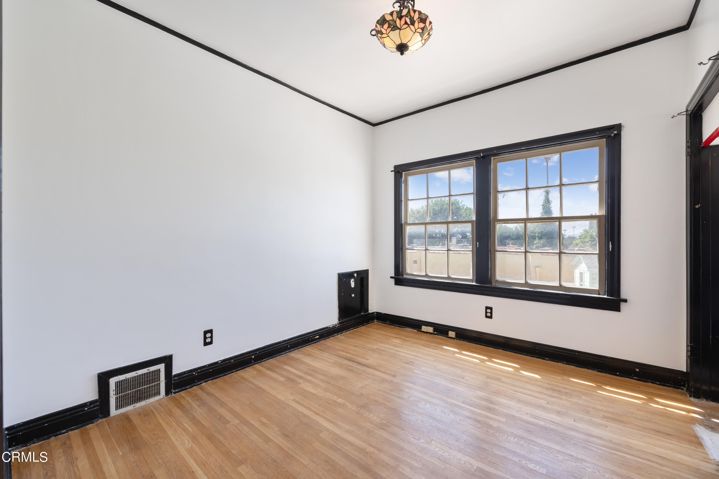 430 West Kenneth Road Glendale, CA 91202 - Photo 29 of 73 an empty room with wooden floor and windows