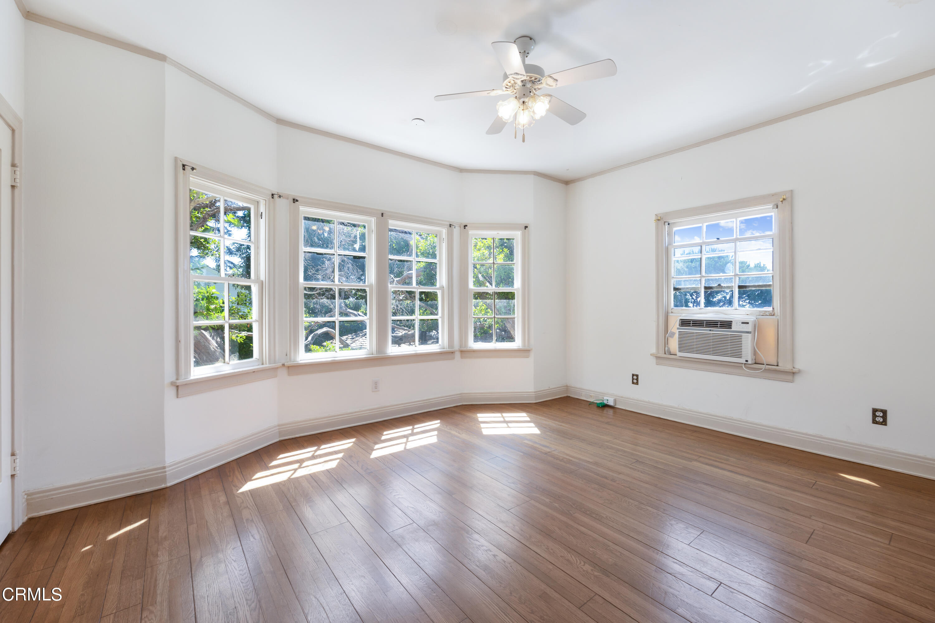 430 West Kenneth Road Glendale, CA 91202 - Photo 33 of 73 a view of an empty room with a window and wooden floor