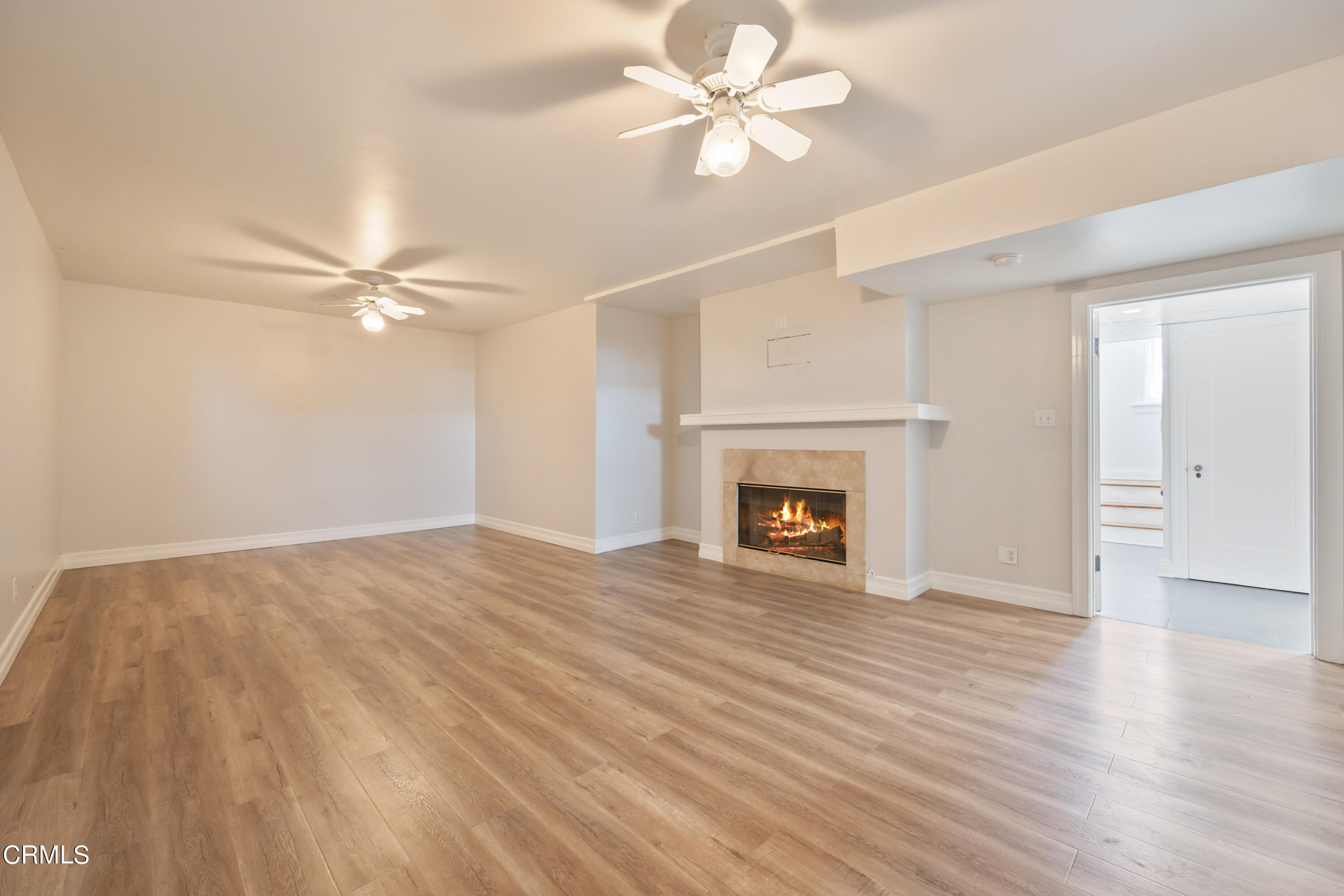 430 West Kenneth Road Glendale, CA 91202 - Photo 37 of 73 a view of an empty room with wooden floor and a fireplace