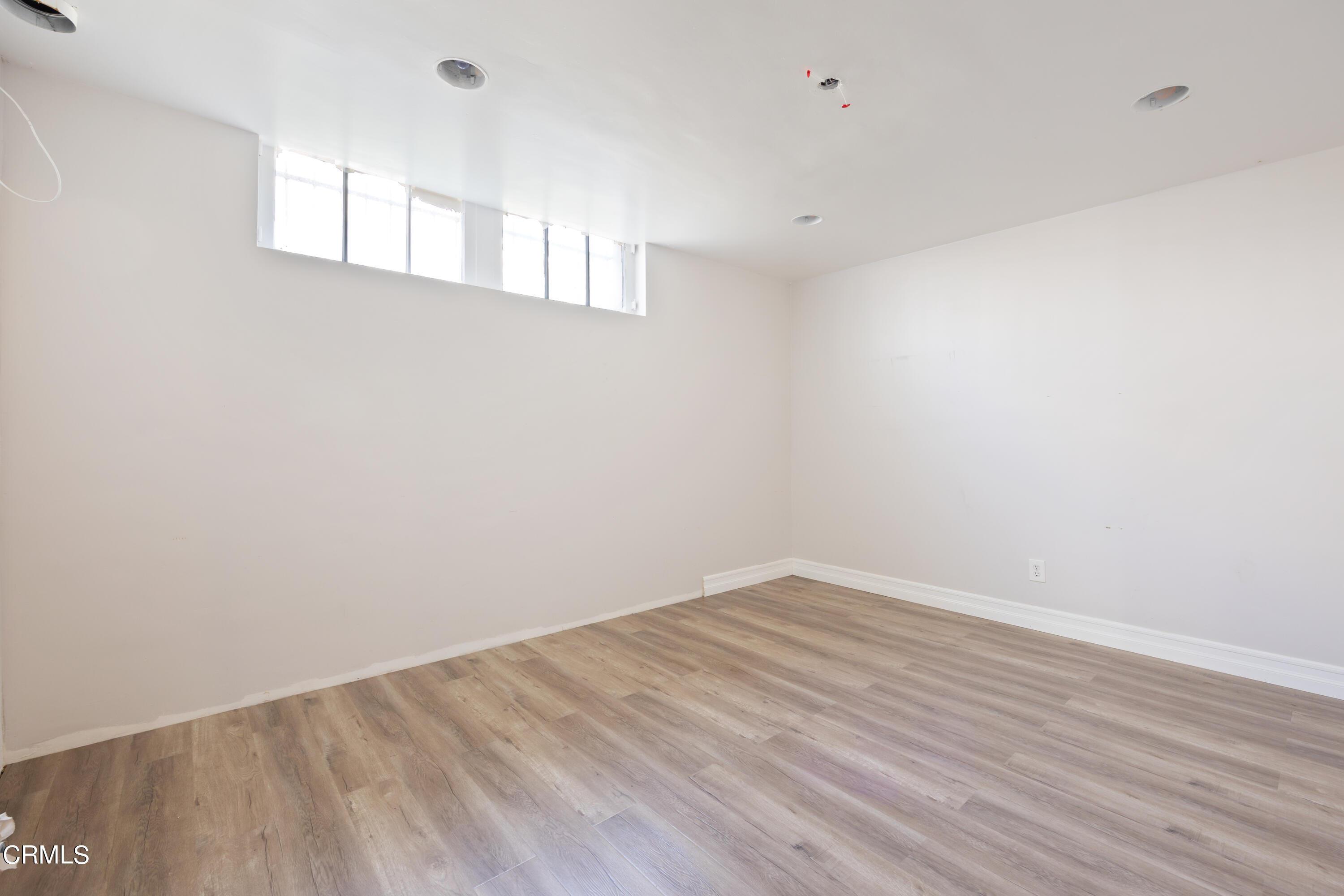 430 West Kenneth Road Glendale, CA 91202 - Photo 40 of 73 a view of empty room with wooden floor and fan